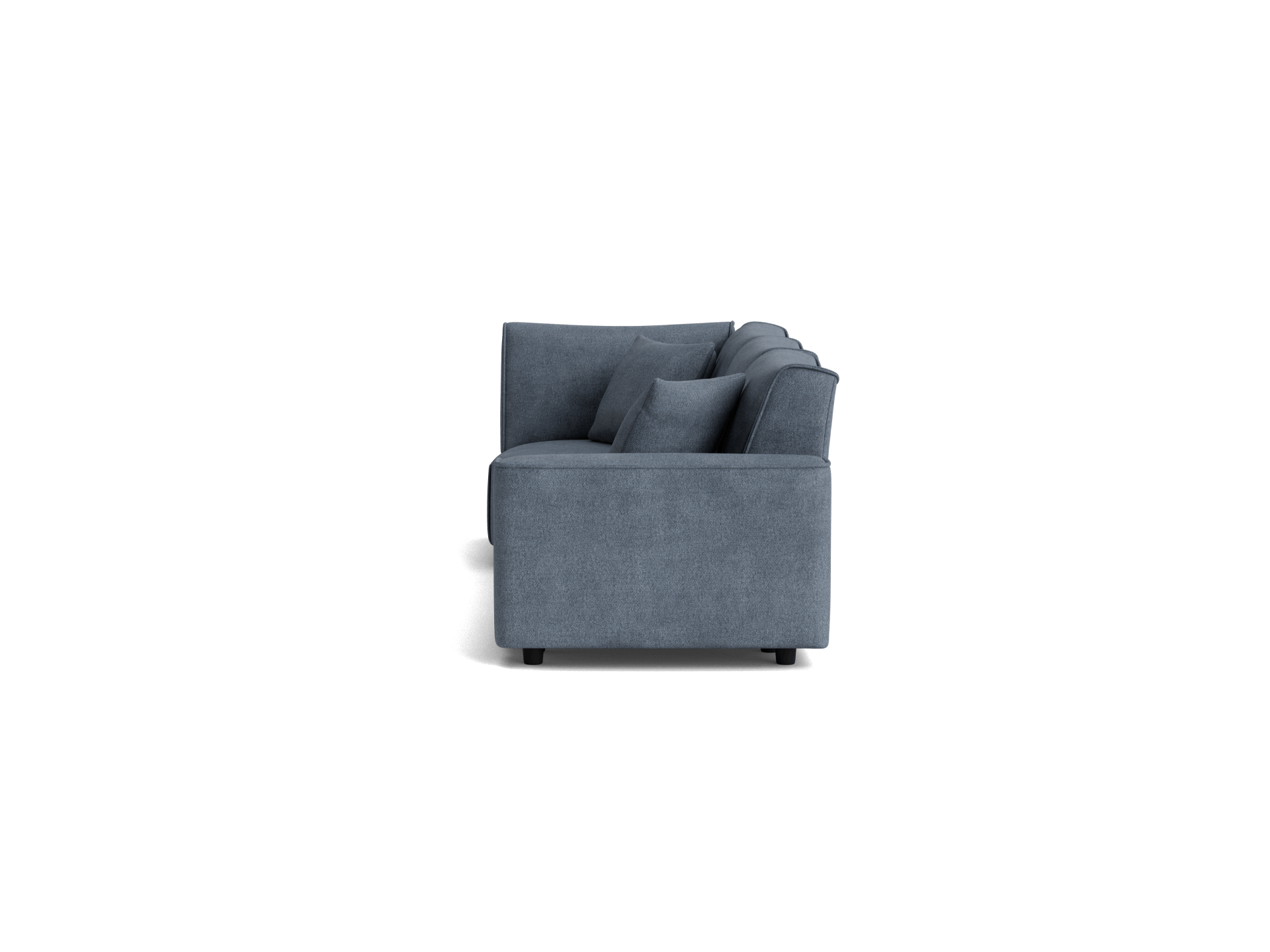 Side view of a modern dark grey fabric sofa with plush cushions, showcasing its boxy design and sleek profile.