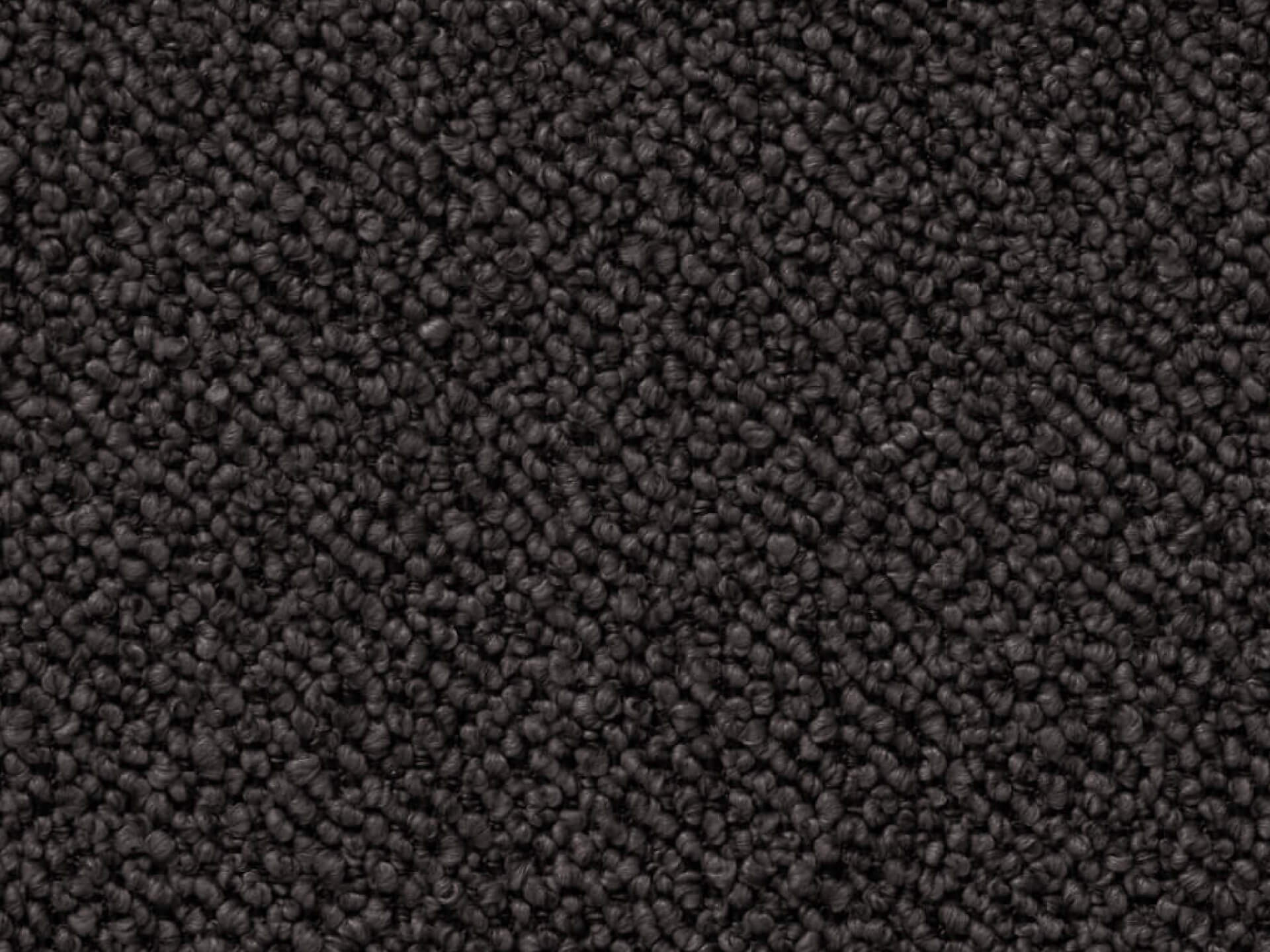 Close-up of dark brown carpet texture with small, tightly packed loops, creating a soft, uniform appearance. Ideal for flooring and upholstery.