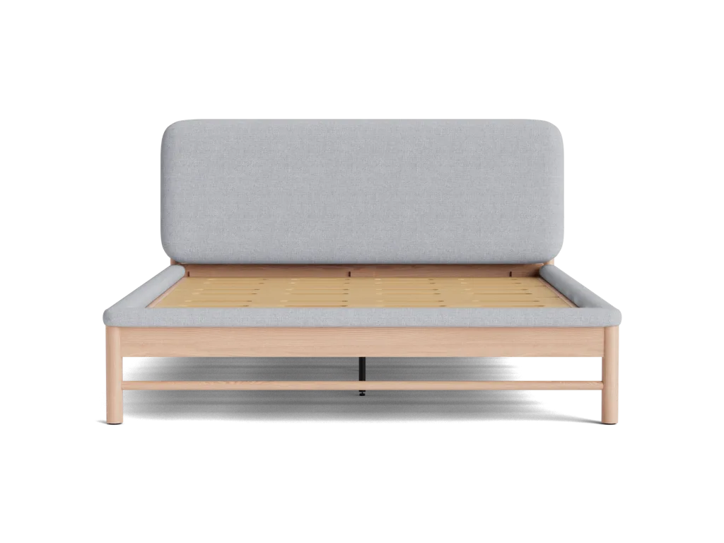 Minimalist bed frame with a light grey upholstered headboard and a natural wood base, viewed from the front.