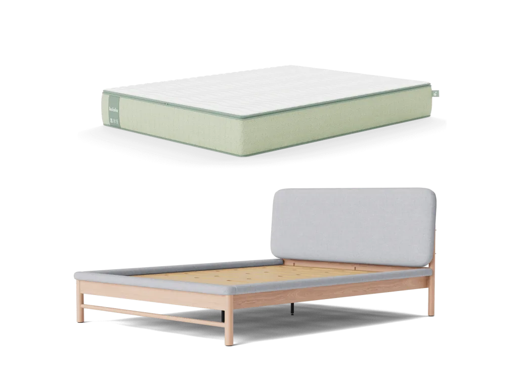 Light wood bed frame with a light grey fabric headboard, paired with a white and light green mattress.