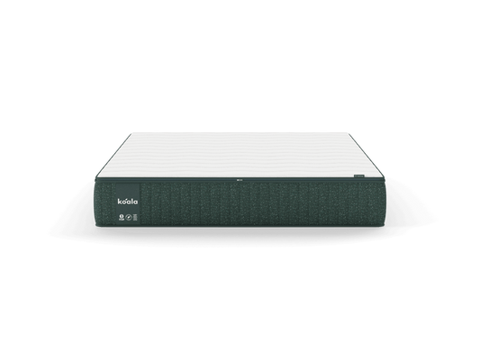 White mattress with dark grey sides, featuring the word "koala" on the corner. Minimalist design, perfect for modern bedrooms.