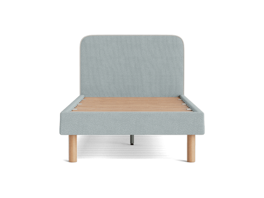 Light grey fabric bed frame with a tall headboard, featuring wooden slats and light wood legs. Simple, modern design ideal for a minimalist bedroom.