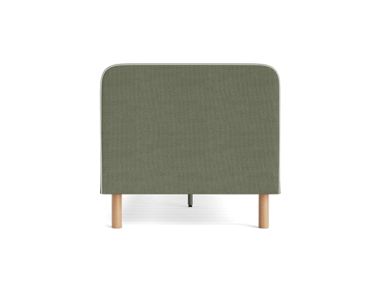 Olive green fabric headboard with rounded edges, supported by light brown wooden legs.