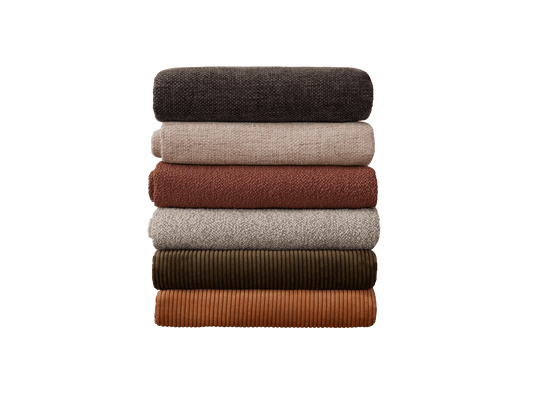 Stack of six folded fabrics in dark grey, beige, brown, light grey, olive, and orange. Textile variety with different textures.