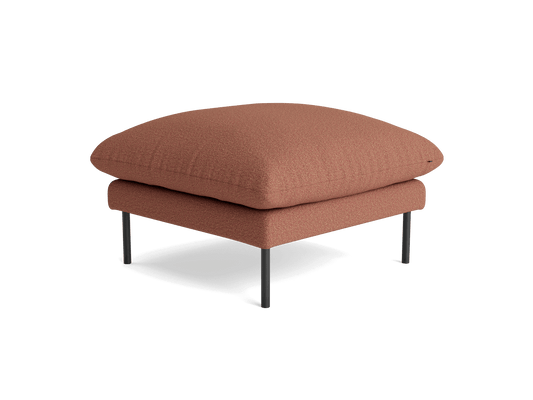 Square ottoman with dark orange fabric and slim, metallic legs.