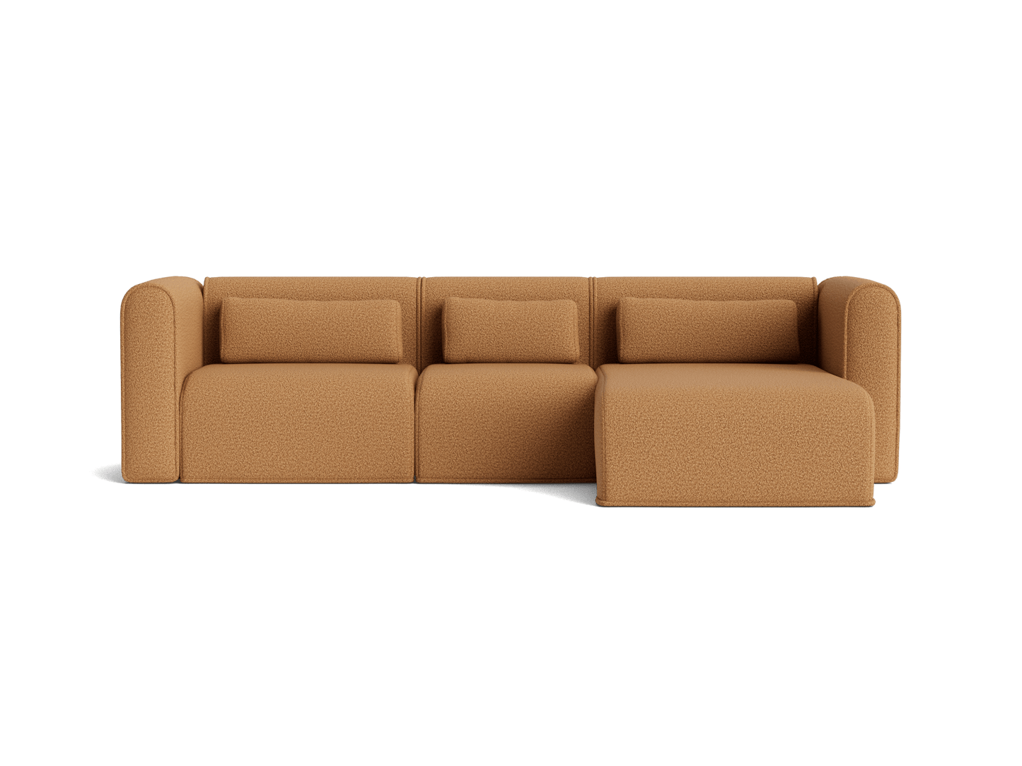 Tan modular sofa with three seats and a chaise on the right, featuring plush cushions and curved armrests.