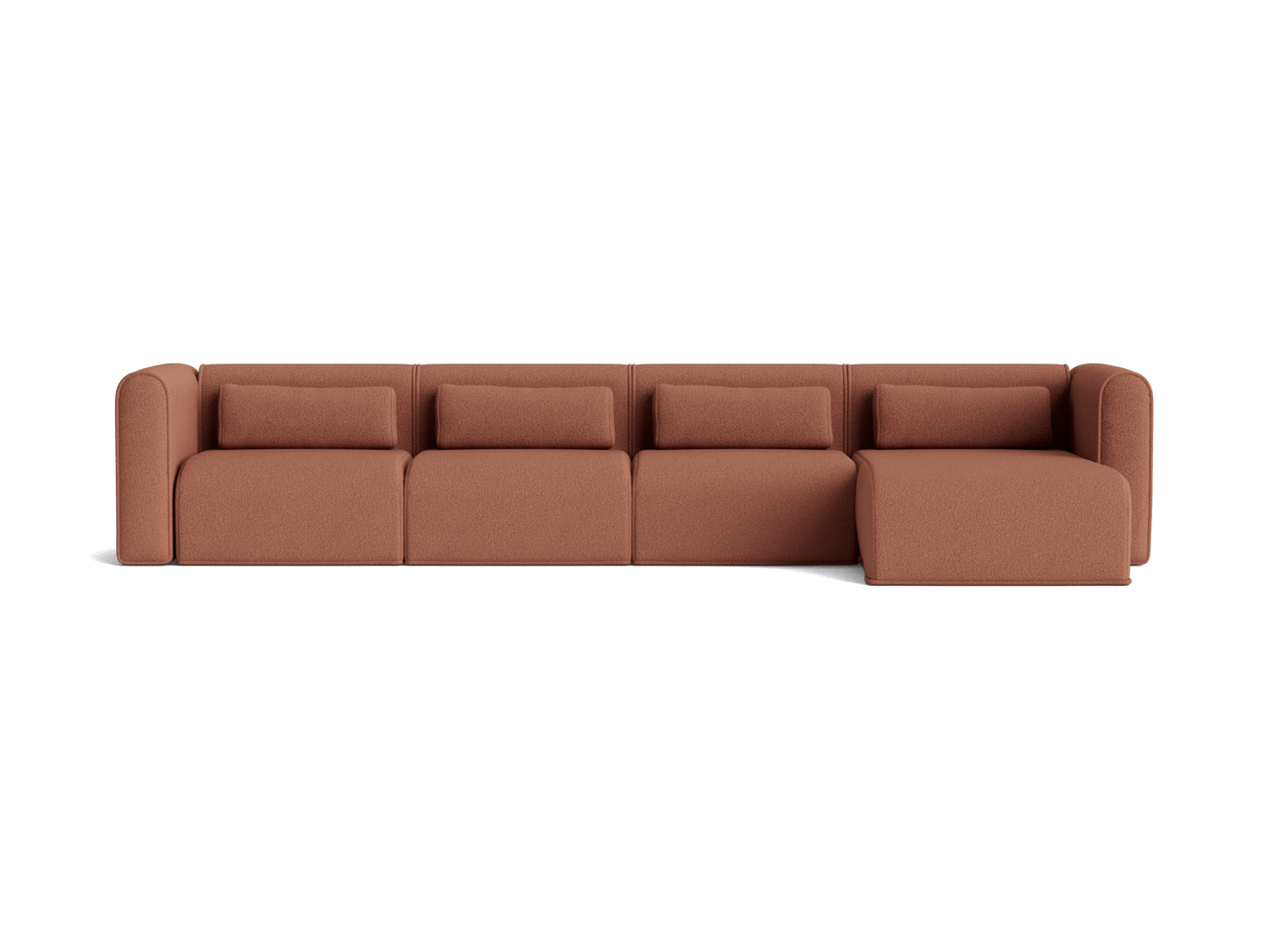 Rust-coloured modular sofa with four cushioned seats and a chaise on the right. Minimalist and modern design.