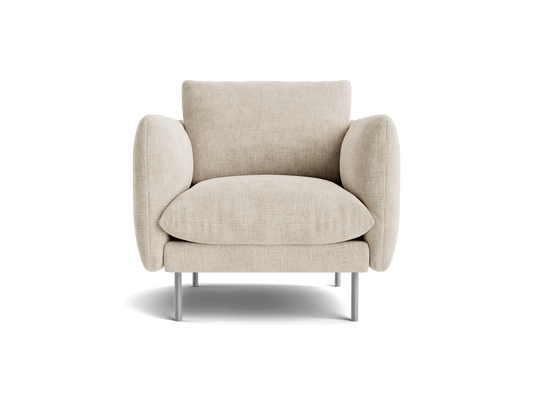 A beige fabric armchair with plush cushions and sleek metal legs, providing a modern and cosy seating option.