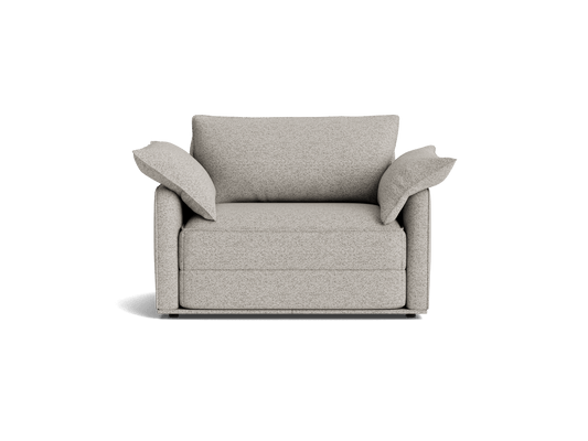 Light grey armchair with wide, angled backrest and armrests. Upholstered fabric, minimalist design. Shadow cast on a plain background.